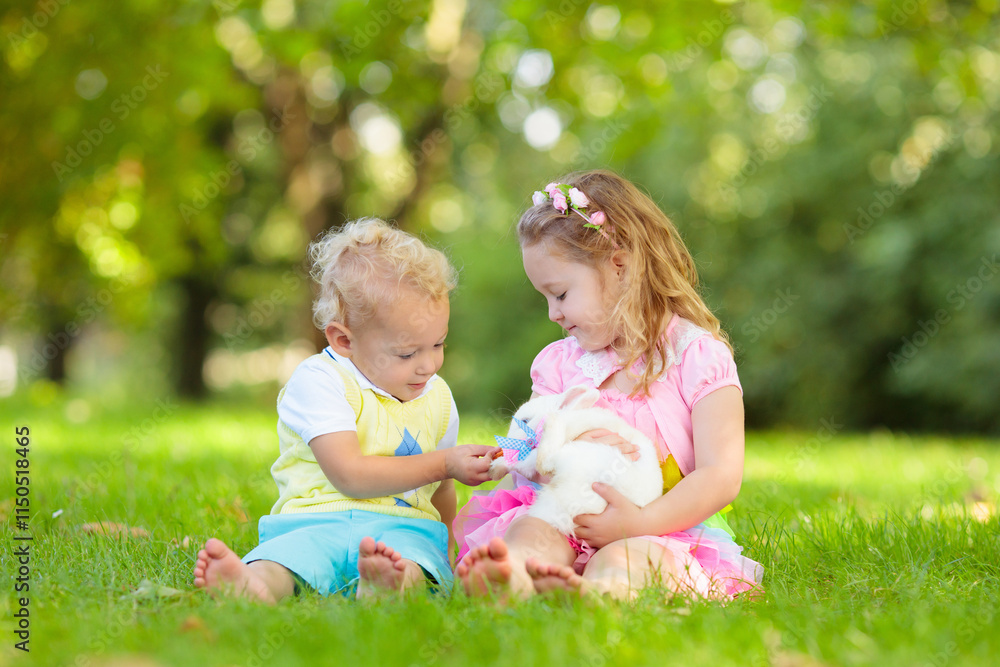 Kids playing with pet rabbit Kids playing with pet rabbit