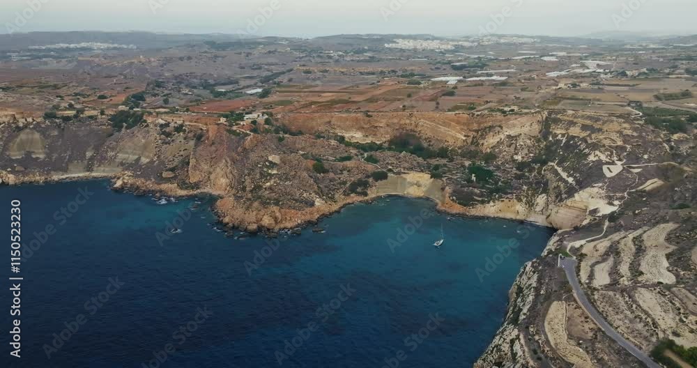 Aerial view of the beautiful nature landscape of the seashore on the island of Malta. A rocky shore of the Mediterranean Sea and a road on it. High quality 4k footage Aerial view of the beautiful nature landscape of the seashore on the island of Malta. A rocky shore of the Mediterranean Sea and a road on it. High quality 4k footage