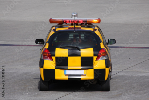 Cuadro en lienzo Guiding the Way - Follow Me Car Leading to Gate at Madeira Funchal Airport