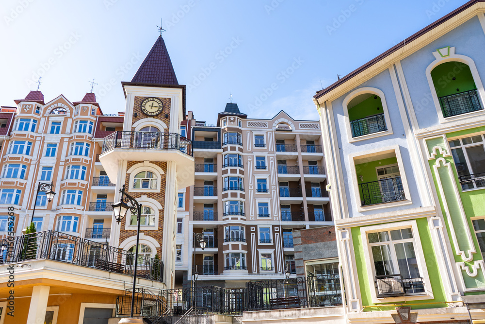 Obraz premium Multicolored modern balconies. Facade of Colorful Houses Buildings. Bright windows architecture. Condominium