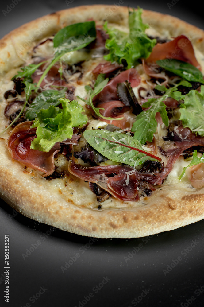 details of the pizza application; juicy pizza from the oven with mushrooms, tomatoes and bacon and sprinkled with parmesan cheese details of the pizza application; juicy pizza from the oven with mushrooms, tomatoes and bacon and sprinkled with parmesan cheese