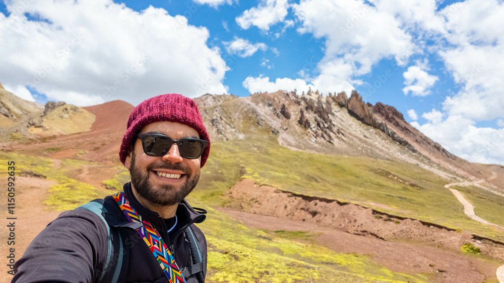 Young traveler hiking a peak of Andes mountain range in Peru Young traveler hiking a peak of Andes mountain range in Peru