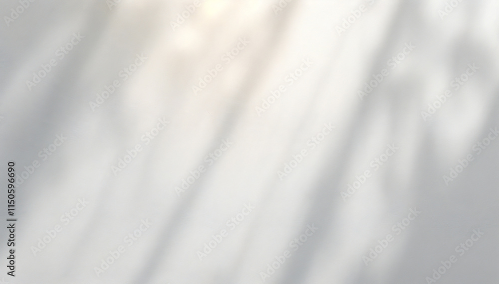 Obraz premium Soft, blurred white background with diagonal light and shadow patterns.