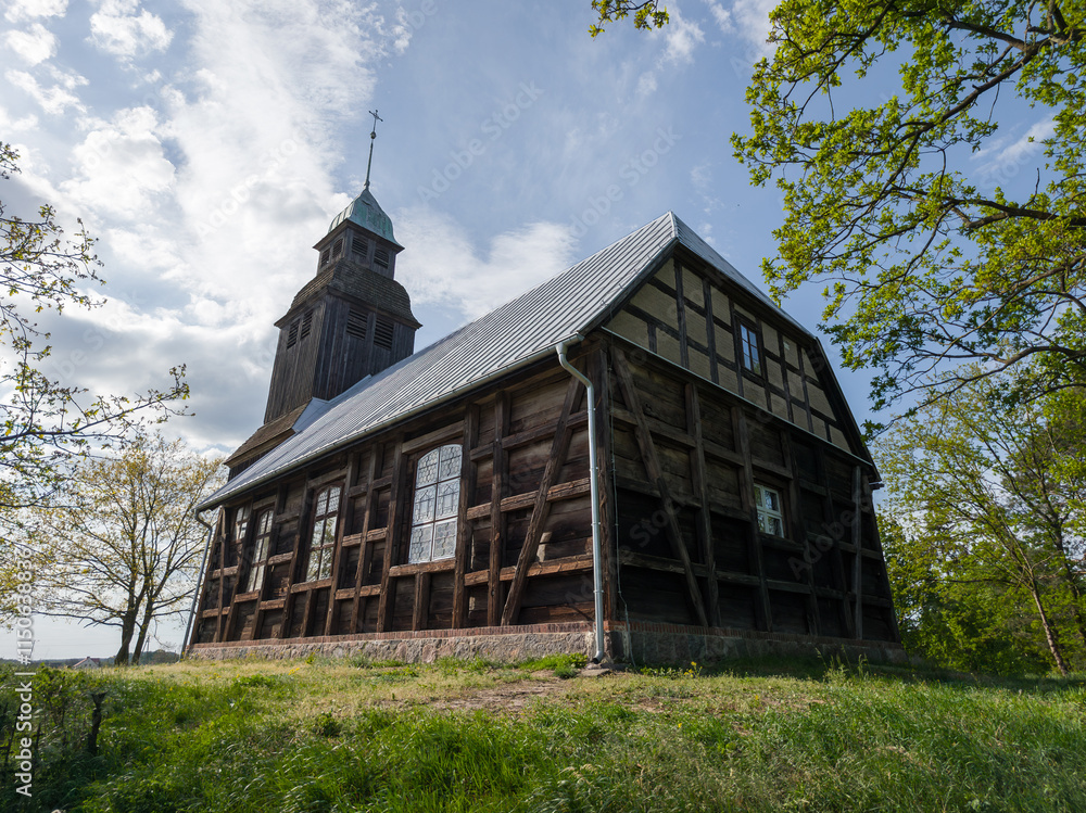 Old wooden catholic church in Nowe Dwory village (Kościół św. Jana Crzciciela in Nowe Dwory). Powiat czarnkowsko-trzcianecki, Wielkopolska, Poland