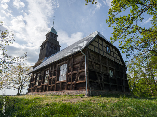 Obraz na płótnie Old wooden catholic church in Nowe Dwory village (Kościół św. Jana Crzciciela in Nowe Dwory). Powiat czarnkowsko-trzcianecki, Wielkopolska, Poland w salonie
