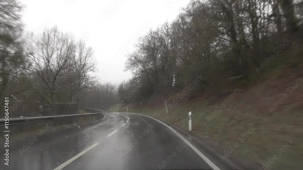 snow falling on a curvy road snow falling on a curvy road