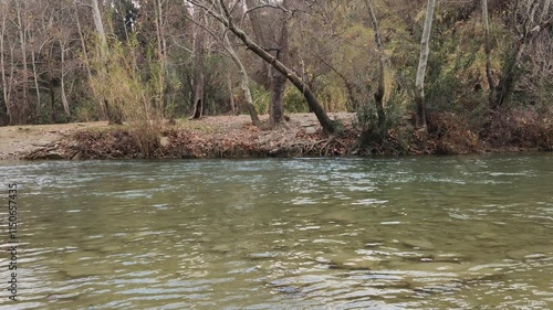 Eglence River (Eğlence Çayı) in Torunsolakli village in Karaisali district of Adana province in Turkey in a rainy winter day. photo