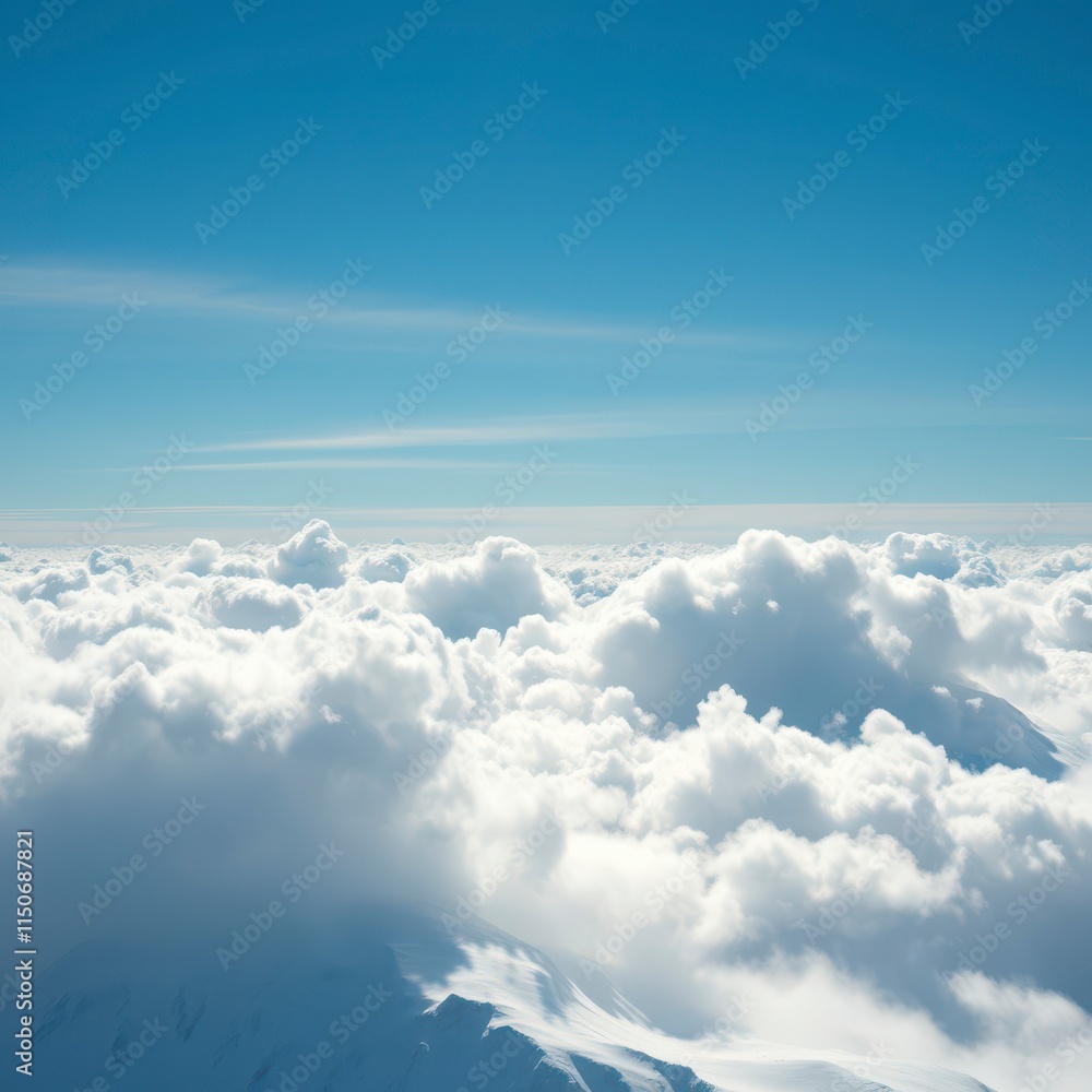 Naklejka premium High-altitude snow cloud against a bright blue sky, rugged landscape, soft, mountainous terrain