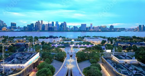 Aerial shot of commercial buildings and skyline in modern city at night in Hangzhou, China photo