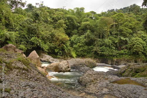 Rapids on the Hollin River, flowing away from the Hollin Waterfall, near Archidona, Ecuador photo