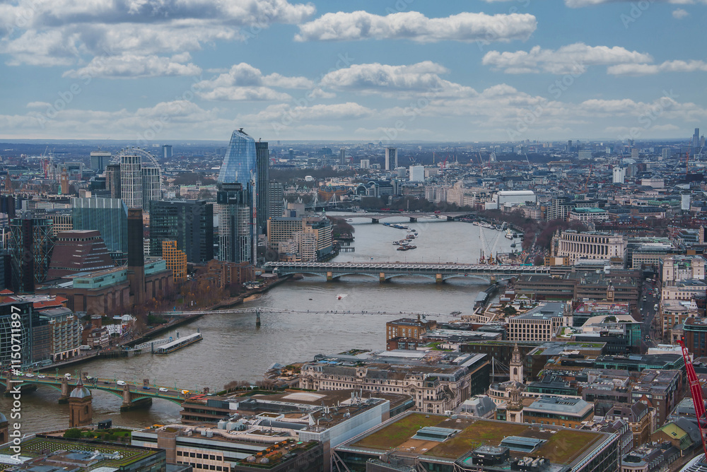 Obraz premium The image captures London's urban landscape with the River Thames, the Shard, and the London Eye. Modern and historic architecture blend under a cloudy sky.