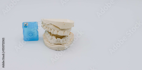 Images Of Dental Impressions, Floss, and Toothbrush For Oral Health National Dentists Day