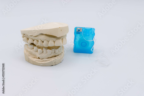 Images Of Dental Impressions, Floss, and Toothbrush For Oral Health National Dentists Day