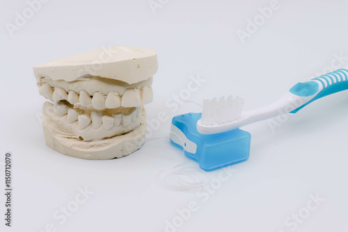 Images Of Dental Impressions, Floss, and Toothbrush For Oral Health National Dentists Day