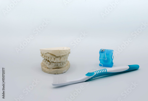 Images Of Dental Impressions, Floss, and Toothbrush For Oral Health National Dentists Day