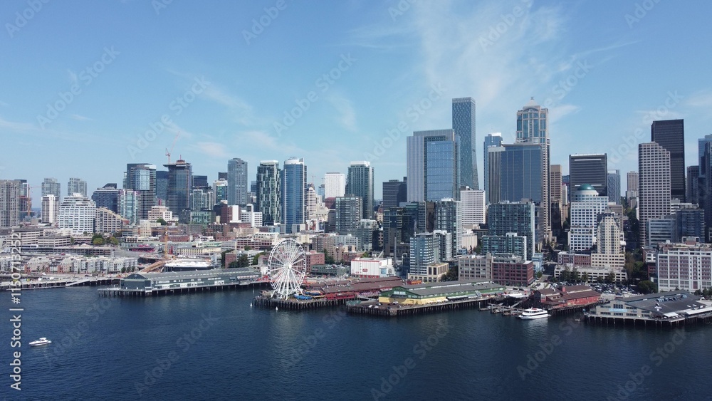 Aerial View of Urban City Skyline and Waterfront Port Area with Ferris Wheel Aerial View of Urban City Skyline and Waterfront Port Area with Ferris Wheel