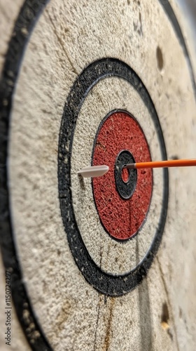 Dart with heart-shaped tip hitting the center of target in a serene blue wate...