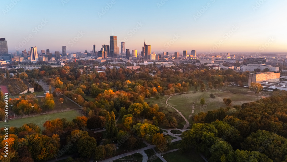Naklejka premium aerial view of warsaw morning panorama with park in background at dawn in autumn