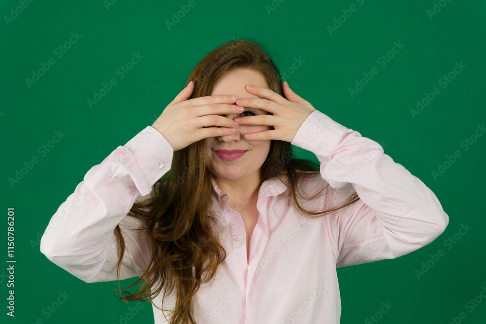 Young beautiful asian girl wearing casual standing over isolated green background Doing peace symbol with fingers over face, smiling cheerful showing victory. High quality photo Young beautiful asian girl wearing casual standing over isolated green background Doing peace symbol with fingers over face, smiling cheerful showing victory. High quality photo