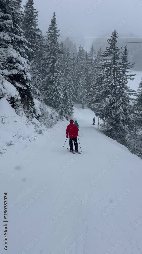 People skiing on the slopes of Courchevel ski resort by winter People skiing on the slopes of Courchevel ski resort by winter