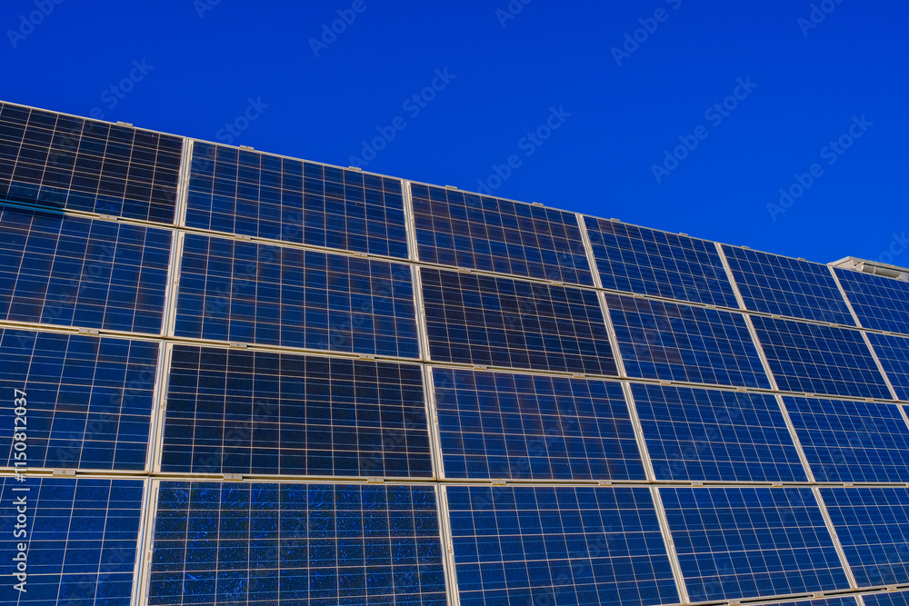 Solar Panel Installation Under Blue Sky.Green energy concept.Renewable clean energy from sunlight.solar power technology. Solar panels advertisement.Alternative natural energy sources Solar Panel Installation Under Blue Sky.Green energy concept.Renewable clean energy from sunlight.solar power technology. Solar panels advertisement.Alternative natural energy sources