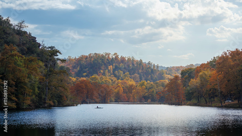 Fototapeta Naklejka Na Ścianę i Meble -  Autumn Colors and a Lone Boat on Broken Bow Lake