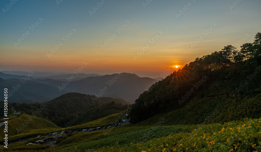 Fototapeta premium Natural landscape sunset sky on top of mountain and valleys.