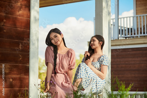 Wallpaper Mural Asian beauty taking photos and enjoying the scenery outside the villa gate in summer Torontodigital.ca