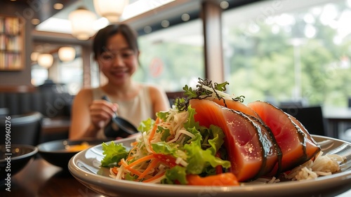 Asian woman enjoying sashimi tuna salad in a Japanese restaurant setting, background, tuna photo