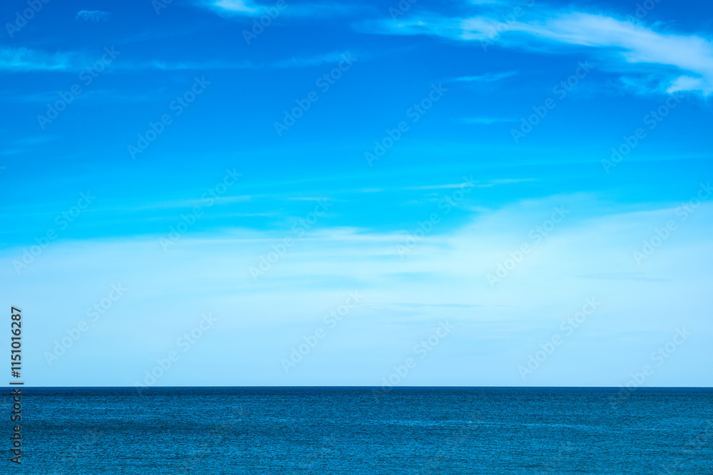 Obraz premium Nature of the beach and sea Summer with sunshine, sandy beaches, clear blue waters sparkling against the blue sky. On an island with good ecology and environment Background for summer vacation 