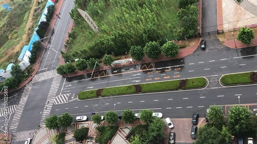 Stunning aerial view of Lushun District in Dalian showcasing skyscrapers amidst rainfall photo