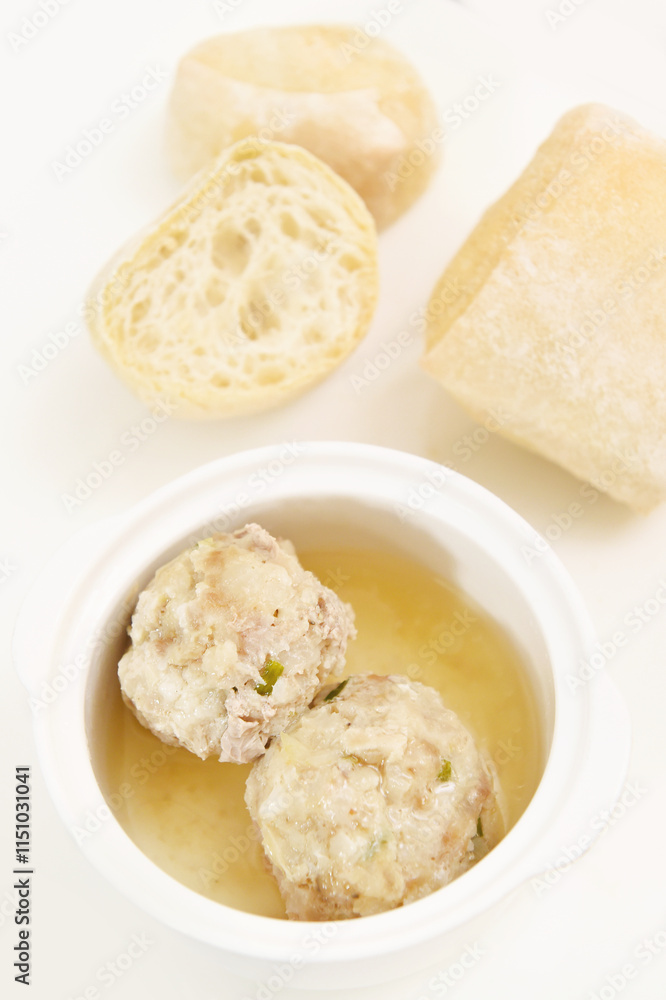 close up of bowls of chicken broth with slices of bread close up of bowls of chicken broth with slices of bread