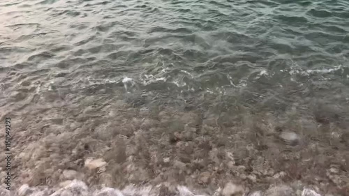 Exploring the serene waves and seaweed at Shandong Penglai Long Island photo