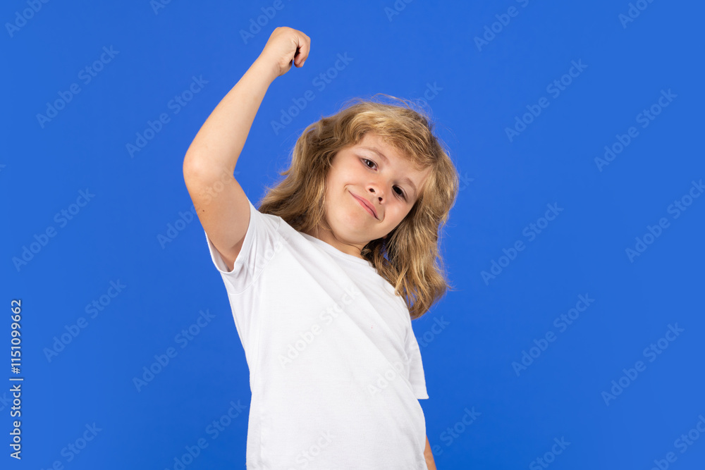Fototapeta premium Excited kid on studio isolated background. Surprised face, amazed emotions of child. Excited kid boy celebrating victory on studio isolated background. Rejoicing, yes gesture and success concept.