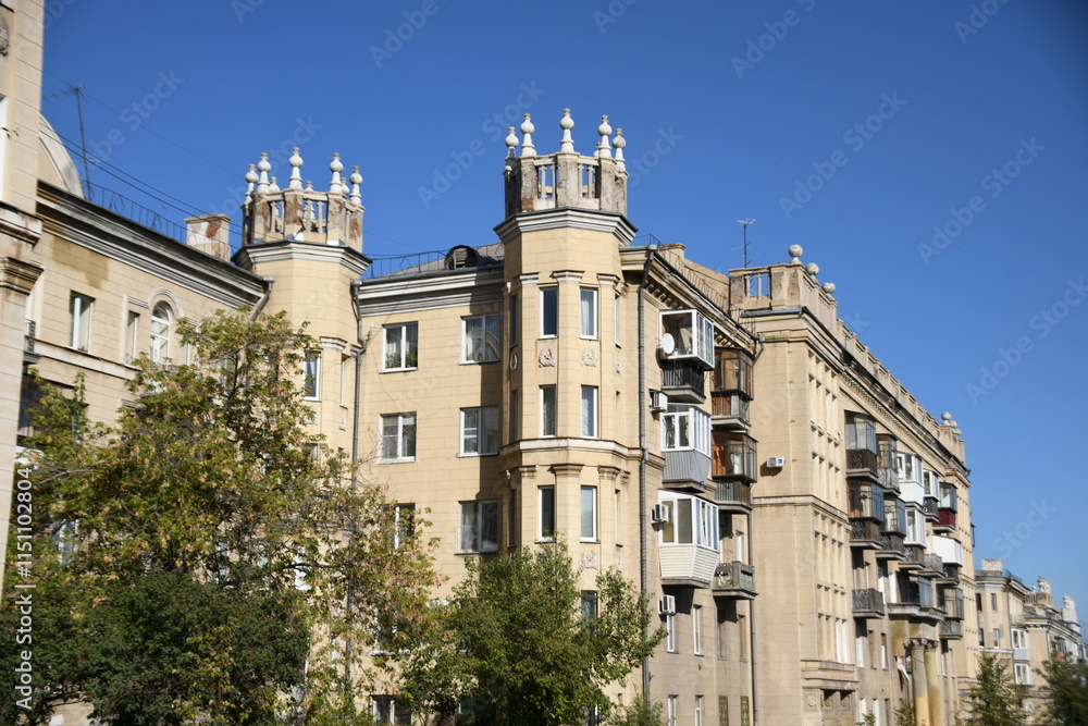 Fototapeta premium Architecture of old Soviet Union houses in Stalin's Empire style. Exterior of the facade of a vintage residential building in Russia