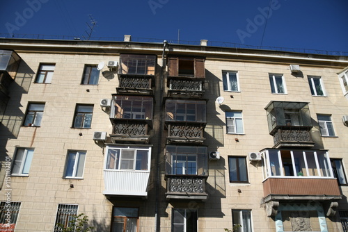 Architecture of old Soviet Union houses in Stalin's Empire style. Exterior of the facade of a vintage residential building in Russia