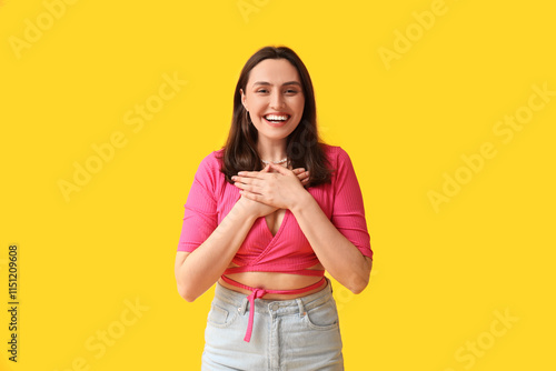 Smiling young woman on yell...