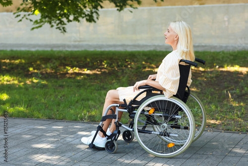 Senior woman in wheelchair ...