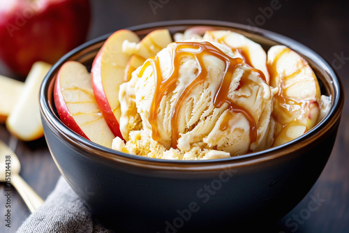 A cozy dessert scene with a bowl of caramel apple ice cream, topped with caramel drizzle and apple slices, warm and inviting photo