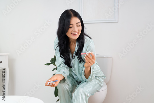 Happy young woman with preg...