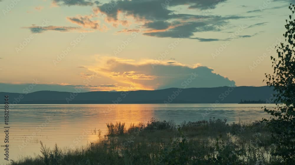 Timelapse: The setting sun behind the mountains. Mountain lake dramatic sky. Timelapse: The setting sun behind the mountains. Mountain lake dramatic sky.