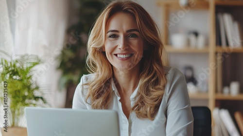 Smiling Woman with Laptop in Cozy Home Office Environment