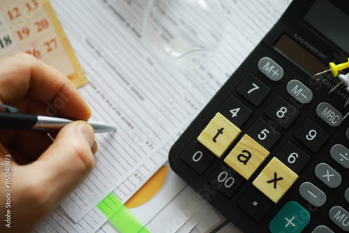 Tax Planning and Preparation with Calculator and Forms photo