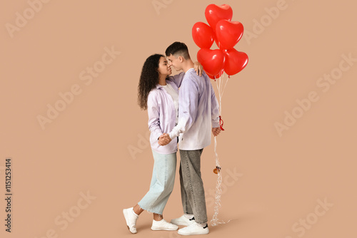 Young couple holding hands ...