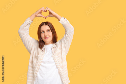 Beautiful young woman makin...