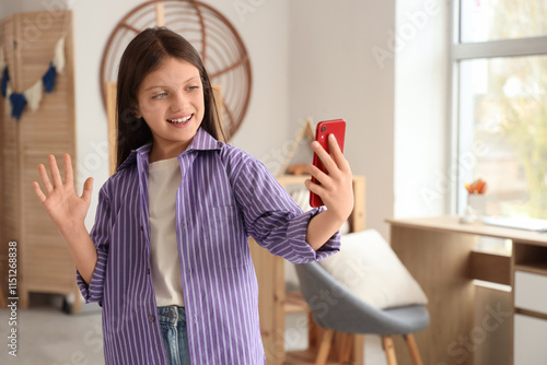 Teenage girl with mobile ph...