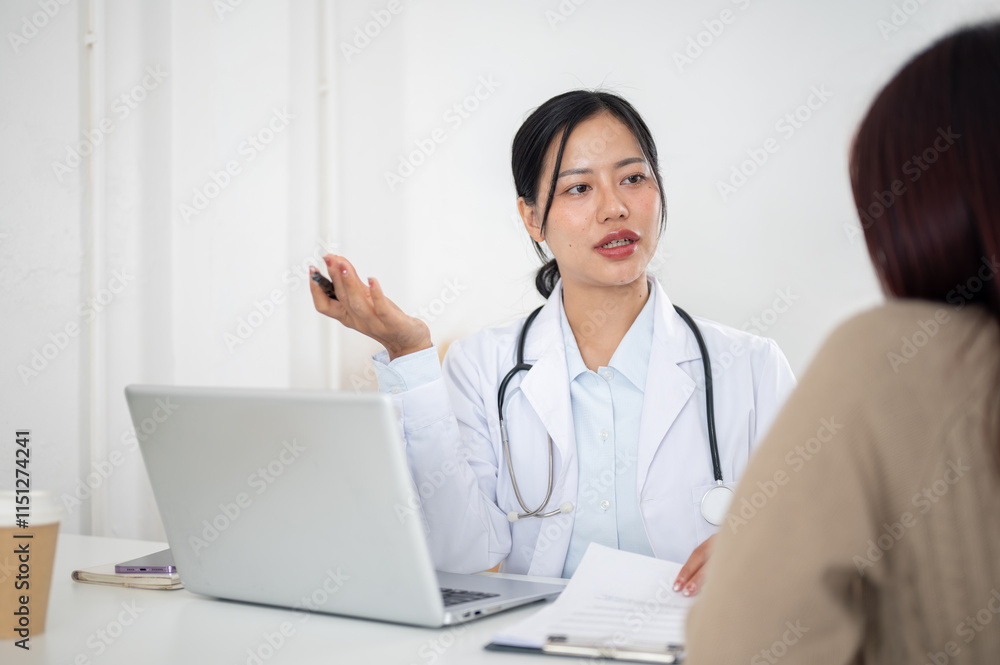 A doctor talking with a patient in the examination room, listening to the patient's symptoms. A doctor talking with a patient in the examination room, listening to the patient's symptoms.