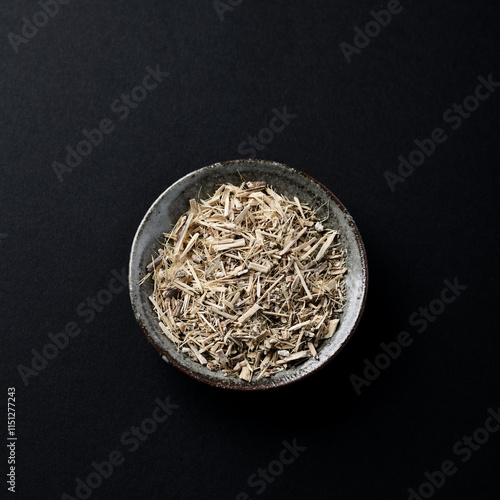 Siberian ginseng (Eleutherococcus senticosus) on dark wooden background. Copy space. photo