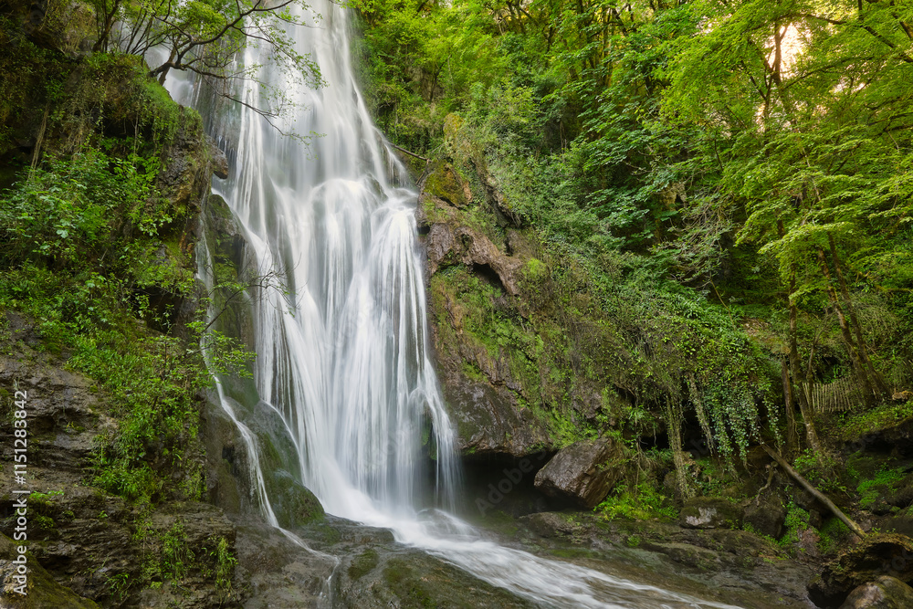 The Cascade d'Autoire waterfall in summer. A 30 meter high waterfall near Autoire in Lot Occitanie Southern France The Cascade d'Autoire waterfall in summer. A 30 meter high waterfall near Autoire in Lot Occitanie Southern France