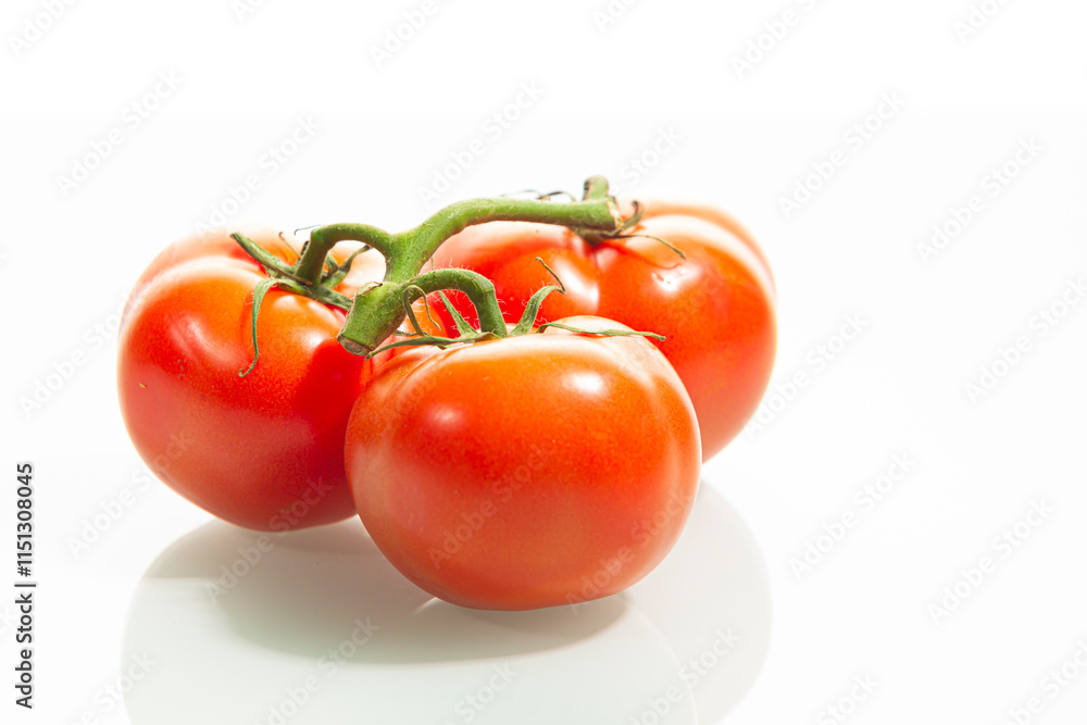 Food Concepts. Small Branch of Red Ripe Romatoes Placed Together Isolated Over Pure White Food Concepts. Small Branch of Red Ripe Romatoes Placed Together Isolated Over Pure White